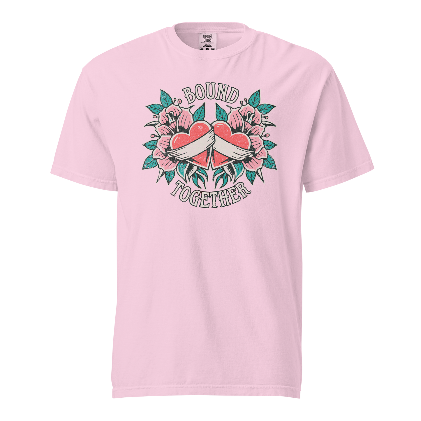 A Vintage Tattoo Inspired Design Featuring two red hearts wrapped together with a white ribbon, surrounded by pink flowers and green leaves in a symmetrical layout. The words 'BOUND' and 'TOGETHER' are displayed in bold, vintage-style serif typography above and below the hearts. The design is mocked up on a orchid comfort colors shirt.