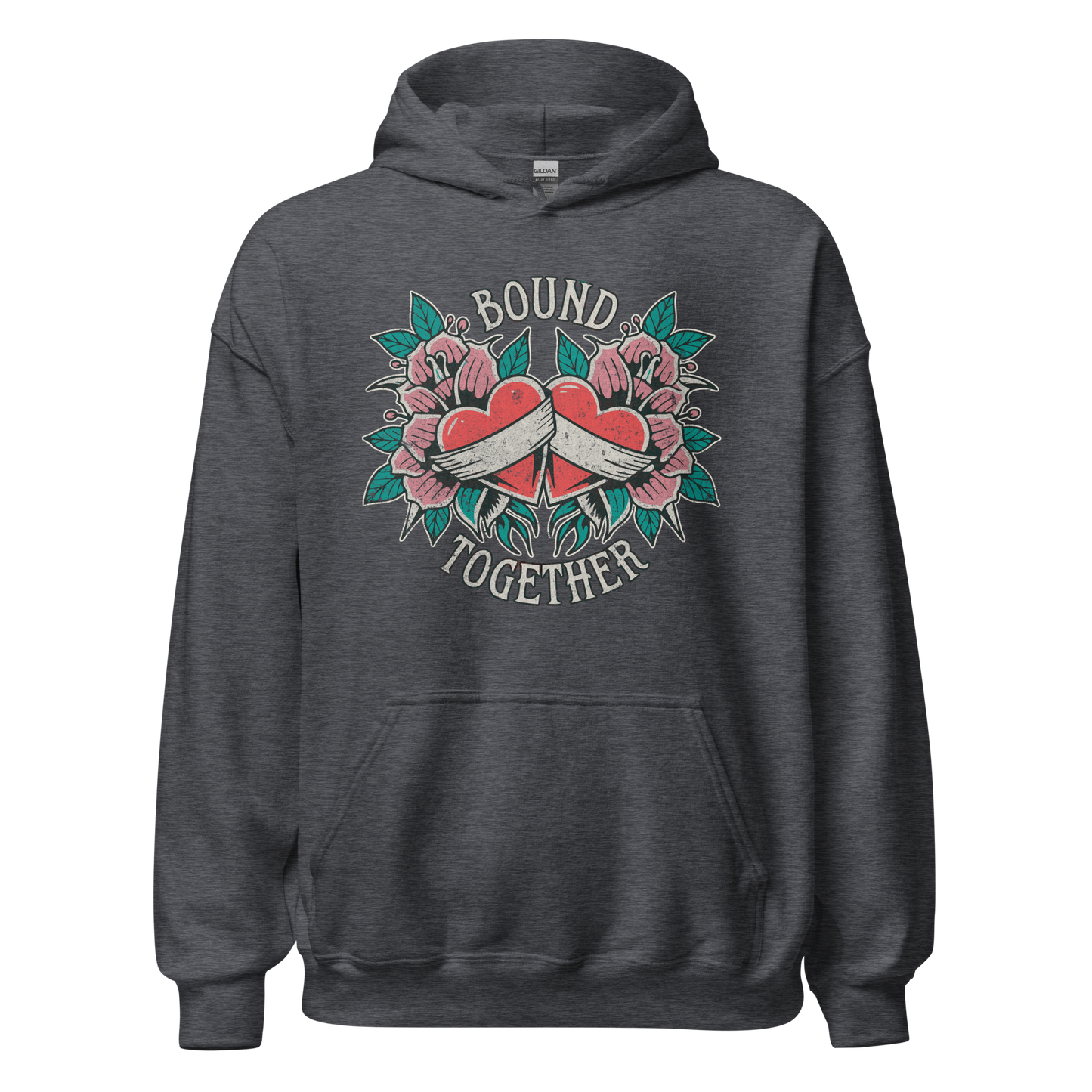 A Vintage Tattoo Inspired Design Featuring two red hearts wrapped together with a white ribbon, surrounded by pink flowers and green leaves in a symmetrical layout. The words 'BOUND' and 'TOGETHER' are displayed in bold, vintage-style serif typography above and below the hearts. The design is mocked up on a dark heather gildan 18500 hoodie.