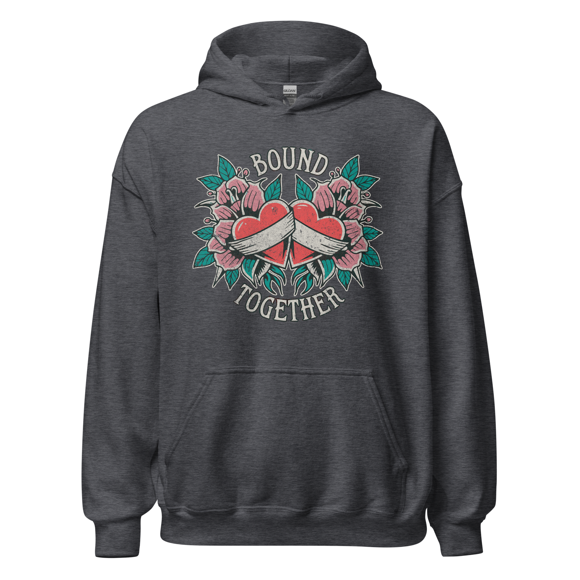 A Vintage Tattoo Inspired Design Featuring two red hearts wrapped together with a white ribbon, surrounded by pink flowers and green leaves in a symmetrical layout. The words 'BOUND' and 'TOGETHER' are displayed in bold, vintage-style serif typography above and below the hearts. The design is mocked up on a dark heather gildan 18500 hoodie.